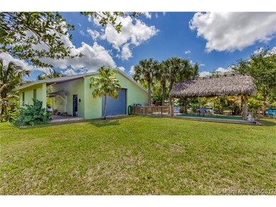 1075 SF 2 Car Garage with Storage and Chickee with Summer Kitchen