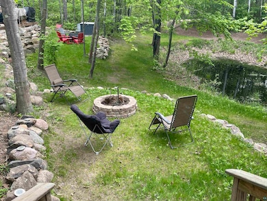 View of yard with a fire pit
