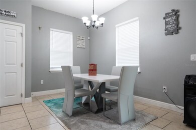Dining area. Kitchen and reach-in pantry at left.