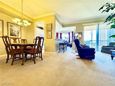 Dining space featuring light carpet, baseboards, a