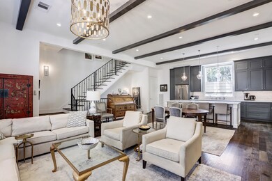 Living, dining and kitchen as seen from fireplace.