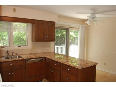 Granite counter tops, beautiful cabinets, ceiling fan, slider to rear deck and Pella casement window