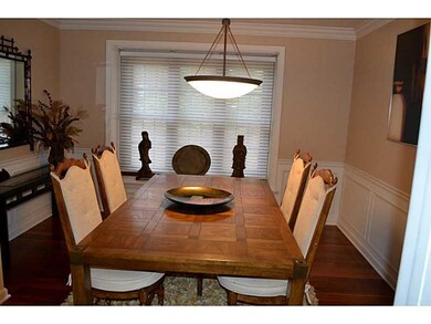 Dining Room. Hardwood floors and a bay window are 