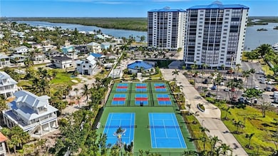 Aerial view of a tennis courts, pickle balls courts and large body of water - Virtually Edited Image