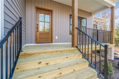Entrance to property featuring a porch