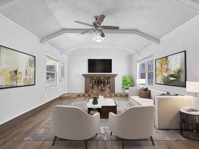 Large Living room featuring new water proof Luxury Plank Vinyl, decorative beamed ceiling and it's own door going to covered patio in back yard.