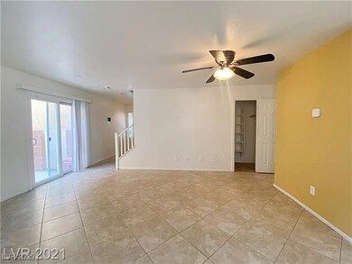 Unfurnished living room featuring light tile patte