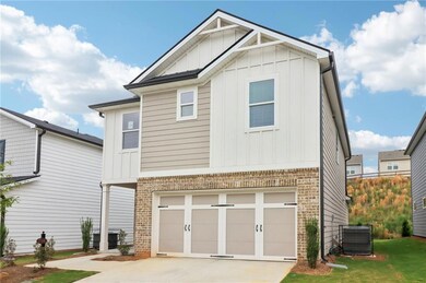View of front of house with an attached garage, bo