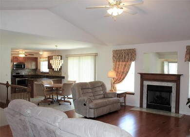 Open, vaulted Great room w Gas Fireplace and marbl