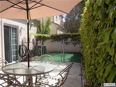 View of private yard. half grass, half concrete pa