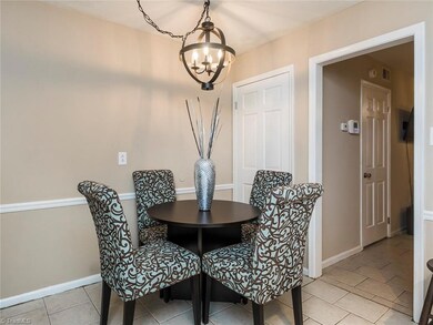 Dining room with new light fixture and chair-rail!