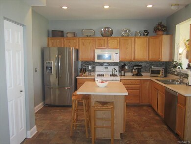View of fully applianced KIT w/oak cabinets,center