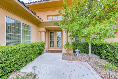 View of exterior entry with stucco siding and fren