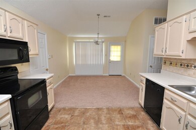 The updated kitchen is highlighted with tile floor
