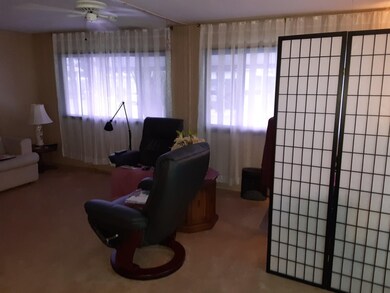 Living Room With Corner Office