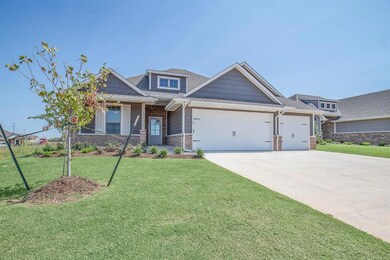 Craftsman-style home featuring a garage and a fron