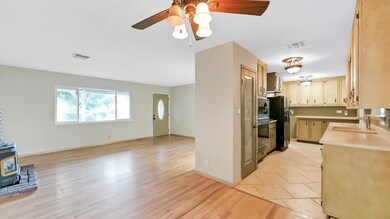 Kitchen flows into Dining & Living Room