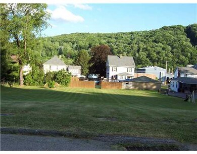 Land/Lot. rear view of home, garage, pool and yard