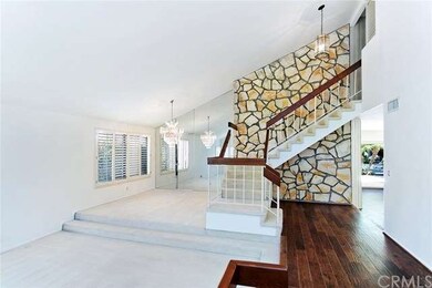 Classic stone draws the eye to the graceful stairc