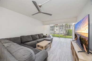 Living area featuring light wood finished floors and ceiling fan