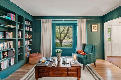 Stunning library with built in shelves and bay window!
