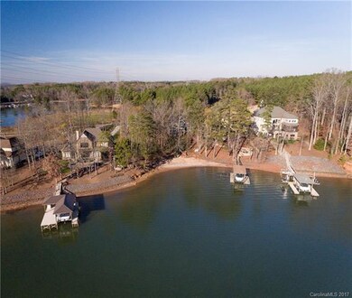 WATERFRONT ALMOST FLAT LOT WITH A SANDY BEACH!