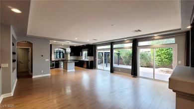 Unfurnished living room featuring visible vents, b
