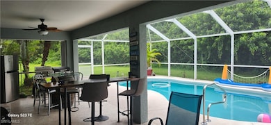 Swimming pool featuring a patio, ceiling fan, a la