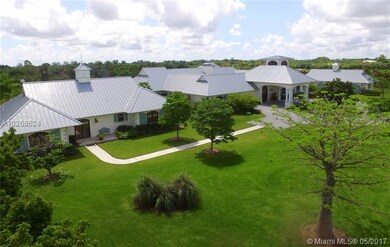 guest, main house built around a open air courtyard, porte-cochere, garage