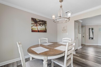 Dining space featuring a chandelier, wood finished