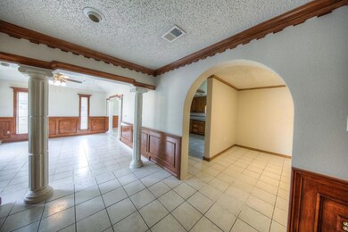 From the front door, Living and Dining to the left and Den and Kitchen ahead.