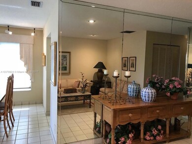 MIRRORED LIVING ROOM WALL