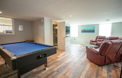 Rec room with light wood-style flooring, billiards table, and recessed lighting