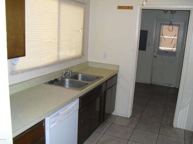 Kitchen with view into Laundry