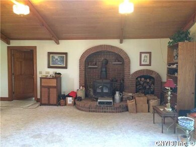 Family Room Wood burning stove in this massive fam