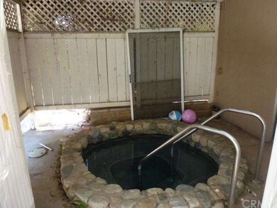 In ground spa fully fenced just outside the family