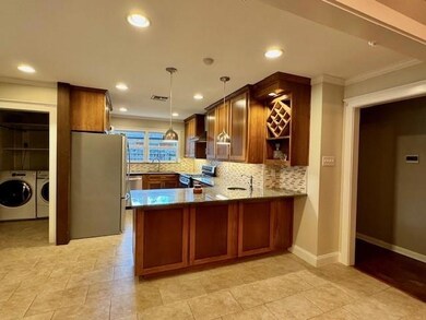 Kitchen with sink, ornamental molding, separate wa