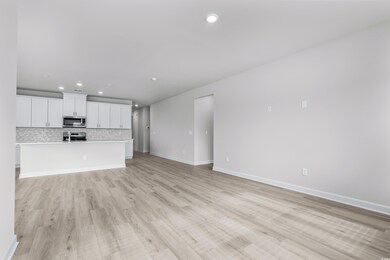 Unfurnished living room with light hardwood / wood