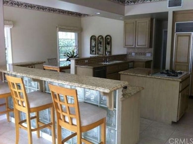 Breakfast bar overlooking spacious kitchen