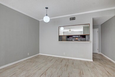 Unfurnished room featuring ornamental molding, ba