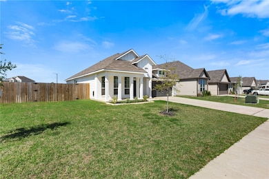 View of front facade featuring concrete driveway,