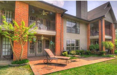 Rear view of property with ceiling fan, a balcony,