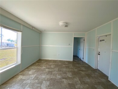 Empty room with crown molding and plenty of natural light
