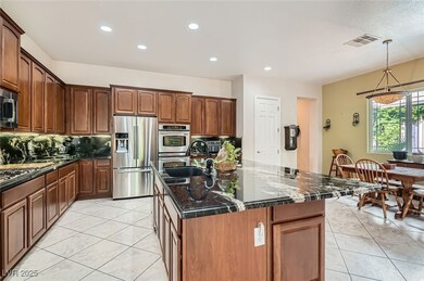 Kitchen with a sink, decorative backsplash, light