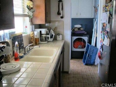 Kitchen opens to the laundry room, with a door to 
