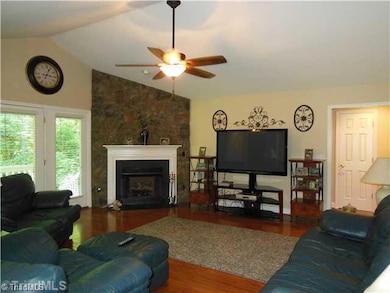 Living Room. Living Room with Gas Log Fireplace, Entrance to Side Porch