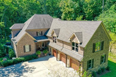 The 3-car garage has an epoxy coated floor, insulated doors, 80-gallon hot water tank, double panel with designated propane gas backup, Generac Home Generator for main floor, and MyQ door openers controlled by app.