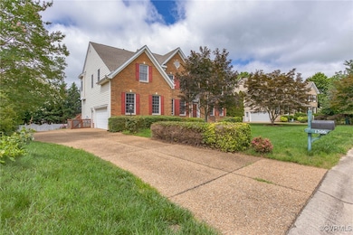 View of front of property with brick siding, an at