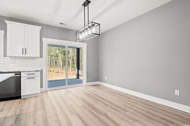 Unfurnished dining area with light hardwood / wood