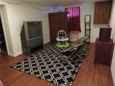 Finished gameroom with laminate flooring and acces